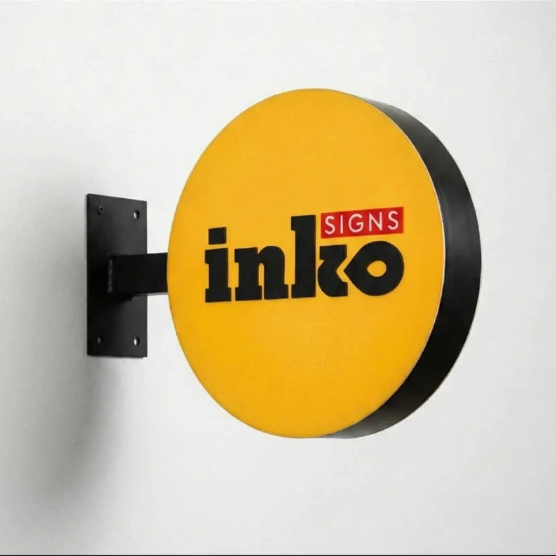 Round sign with 'inko' branding on a white background