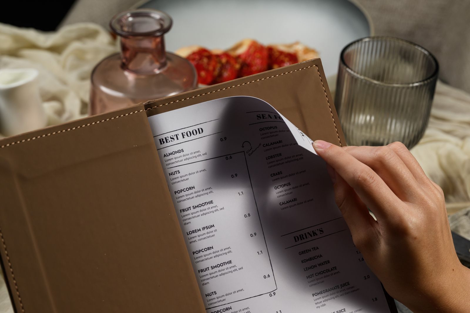 Tan menu cover with printed menu pages