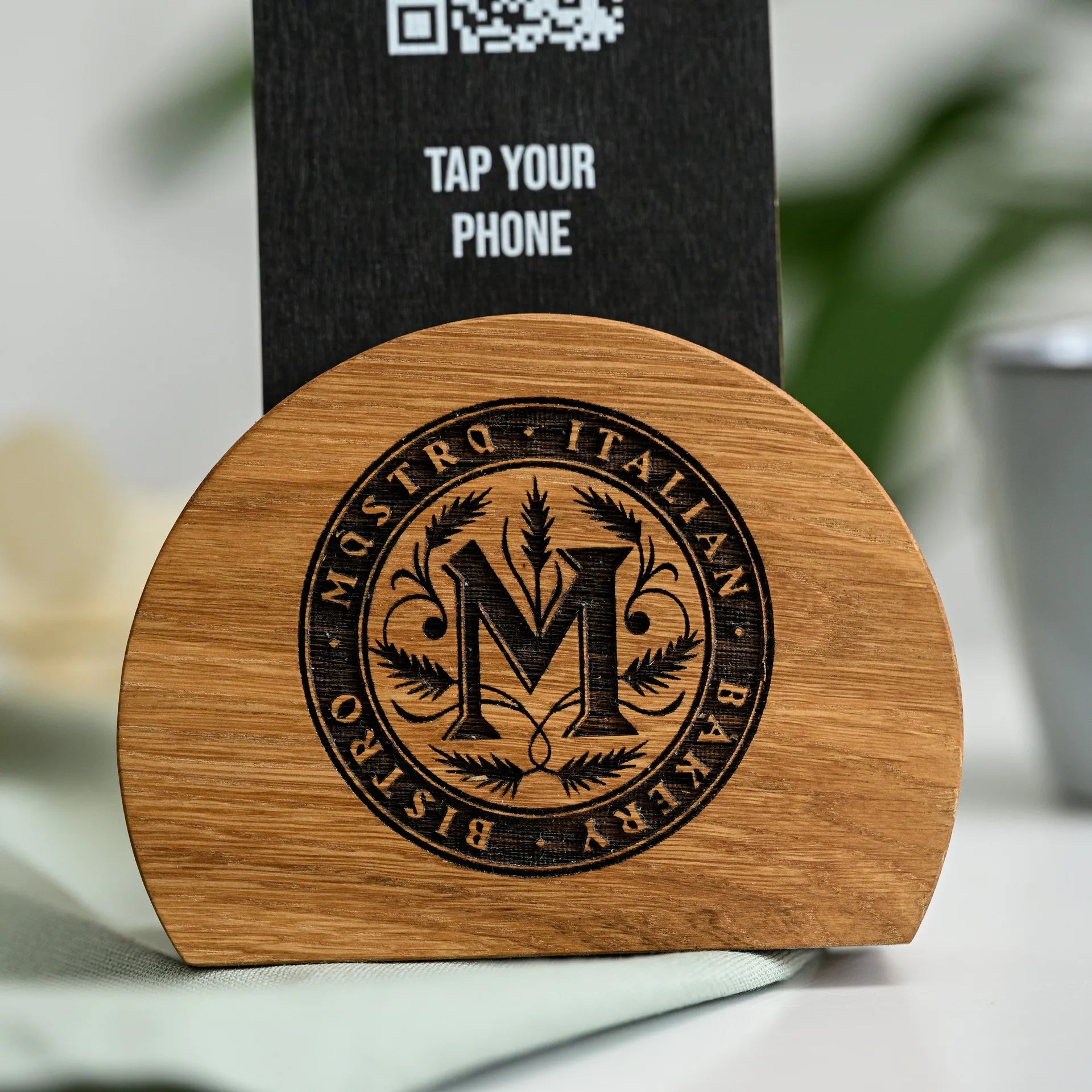 Make information accessible and interactive with our NFC tag and QR code sign mounted on a sophisticated wooden stand, inviting patrons to explore.