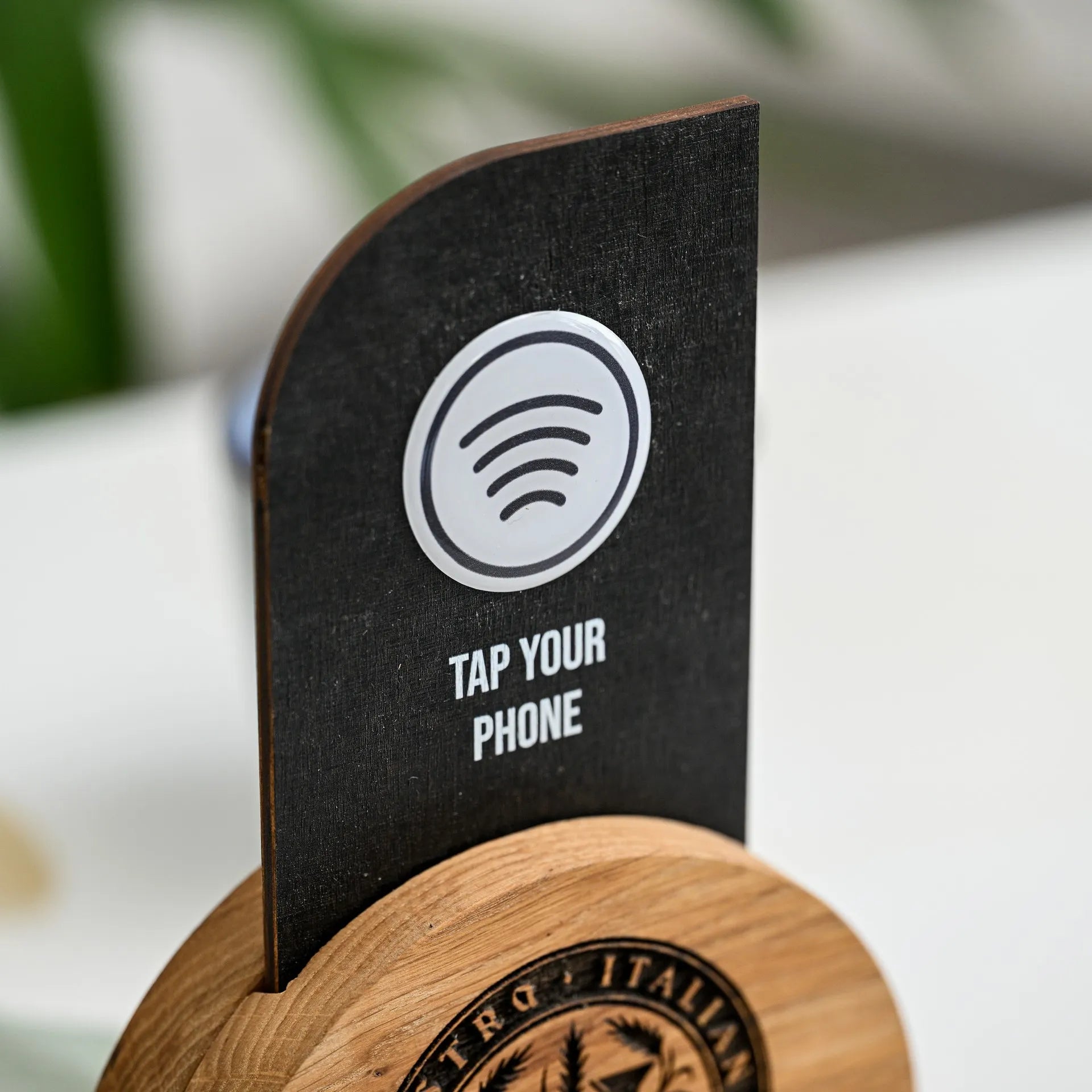 Enhance your customer experience with our NFC tag and QR code sign elegantly displayed on a wooden stand.