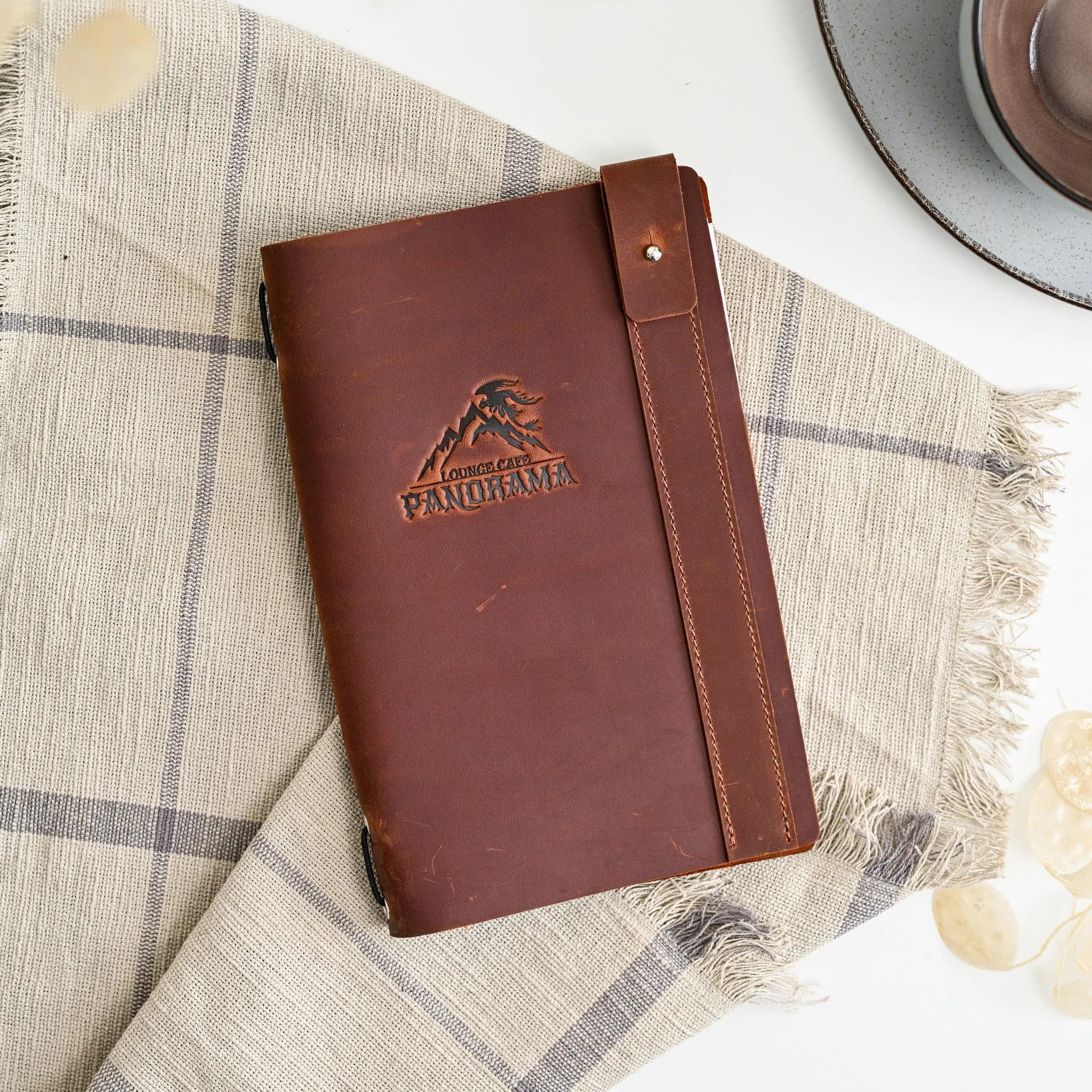 Our handcrafted soft leather menu cover adds a touch of luxury to your restaurant's presentation.