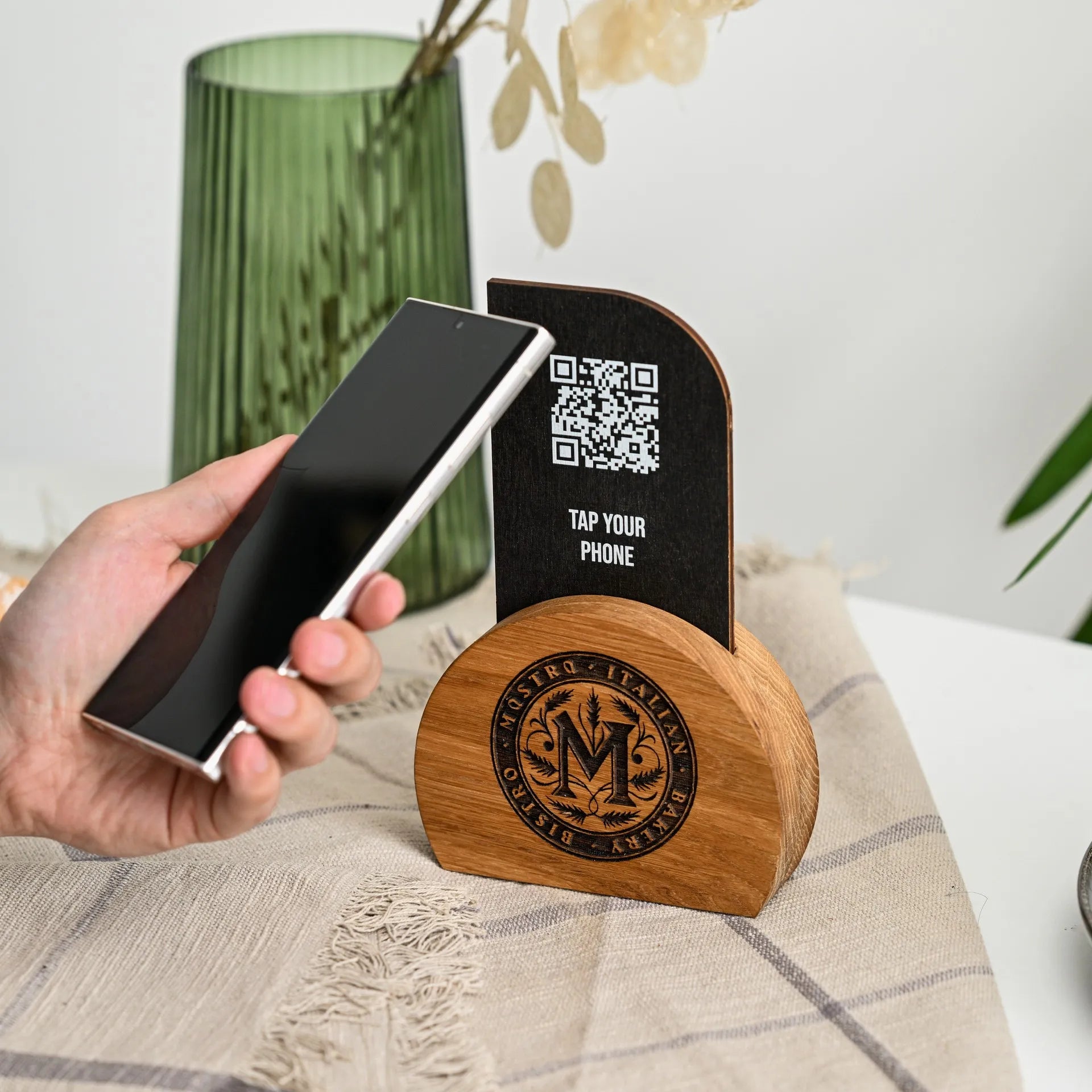 Step into the future of dining with our NFC tag and QR code sign elegantly displayed on a wooden stand, offering convenient access to information.