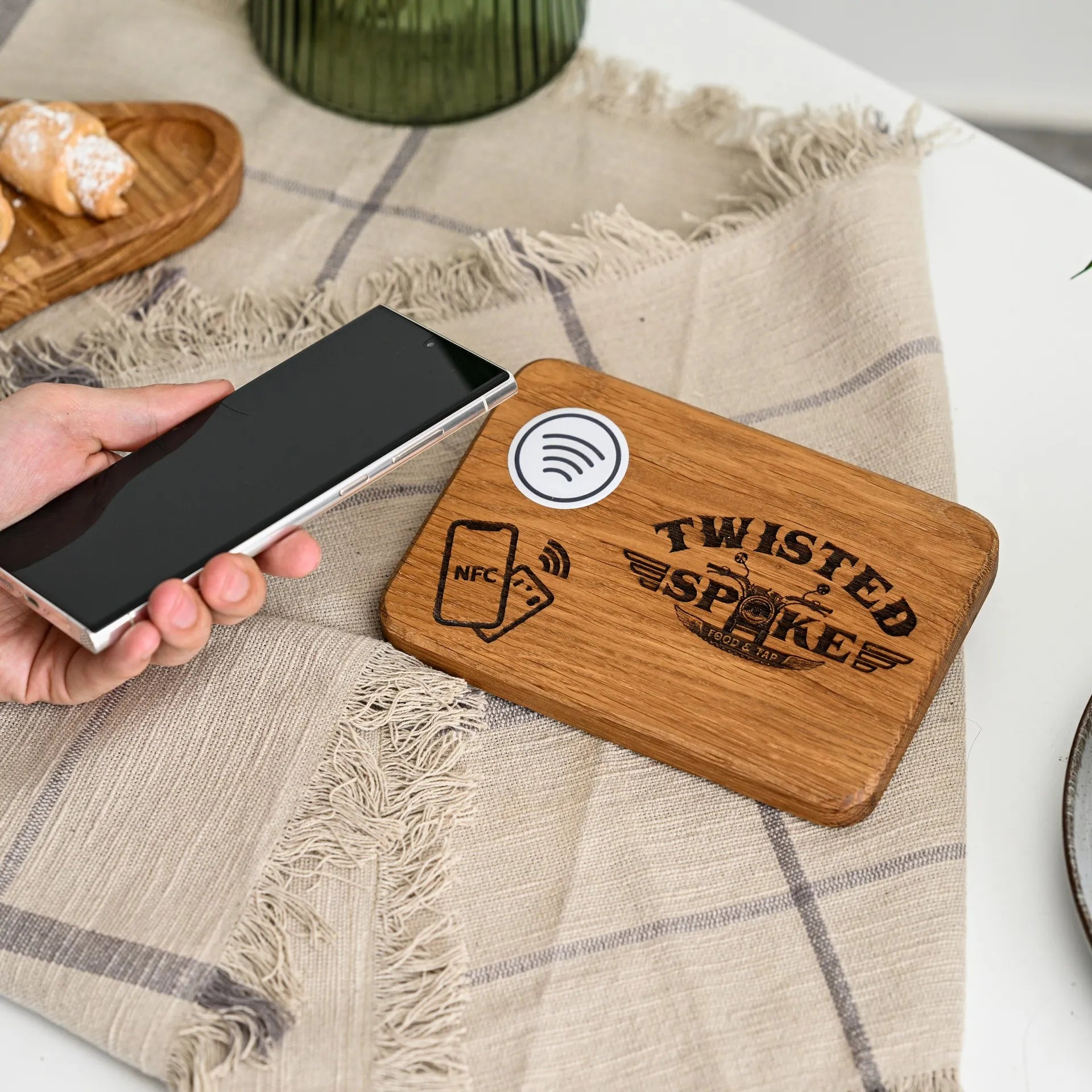 Elegant NFC tap to pay sign with logo engraving, offering a personalized touch to your restaurant's payment process.