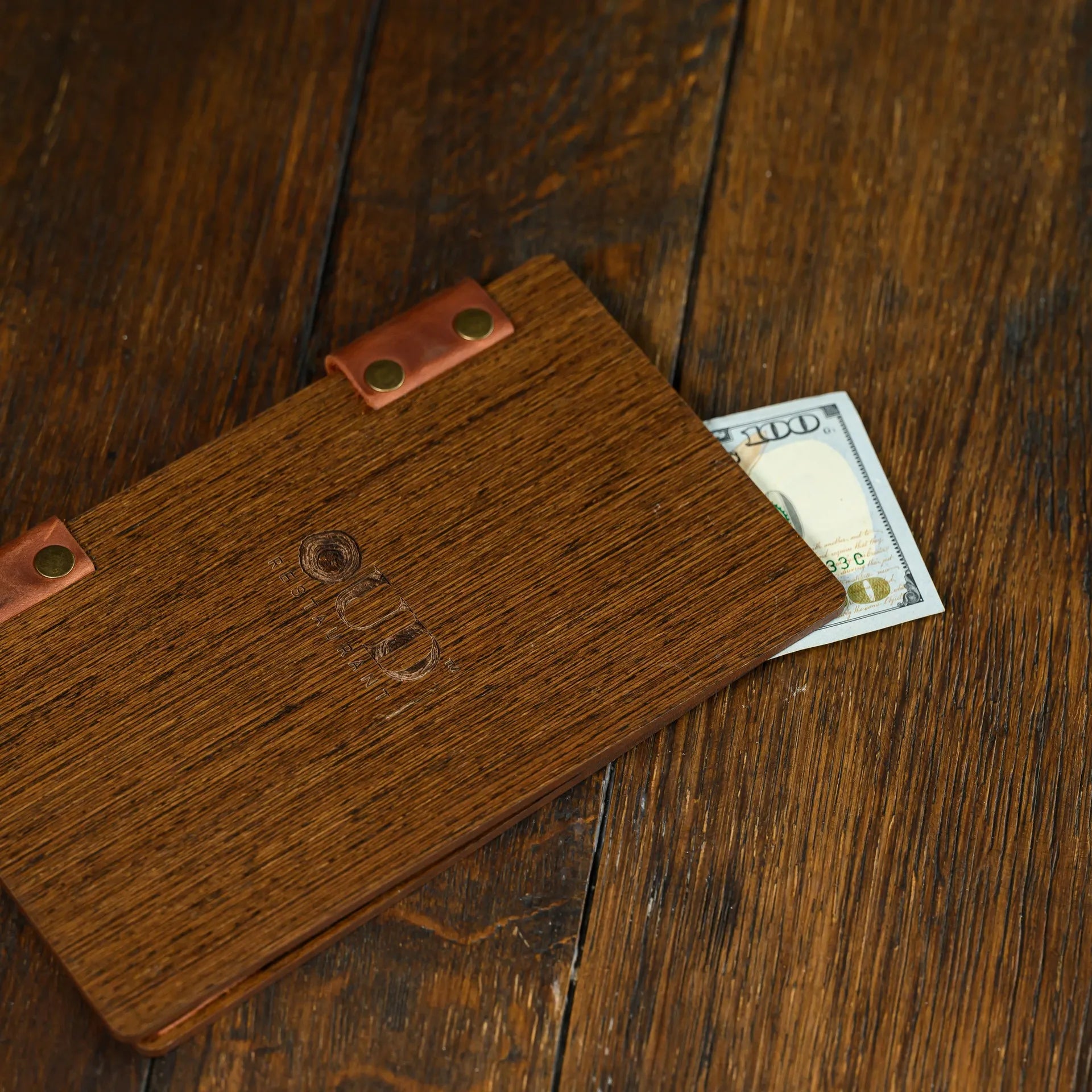 Elegant and durable Veneered HDF Bill Presenter. Features logo engraving for a customized touch, perfect for restaurant use.