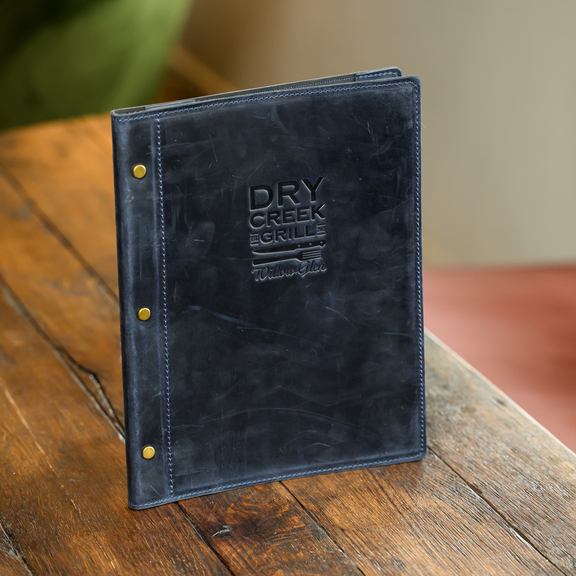 Present your menus confidently with our hard cover holder, featuring secure corner mounting.