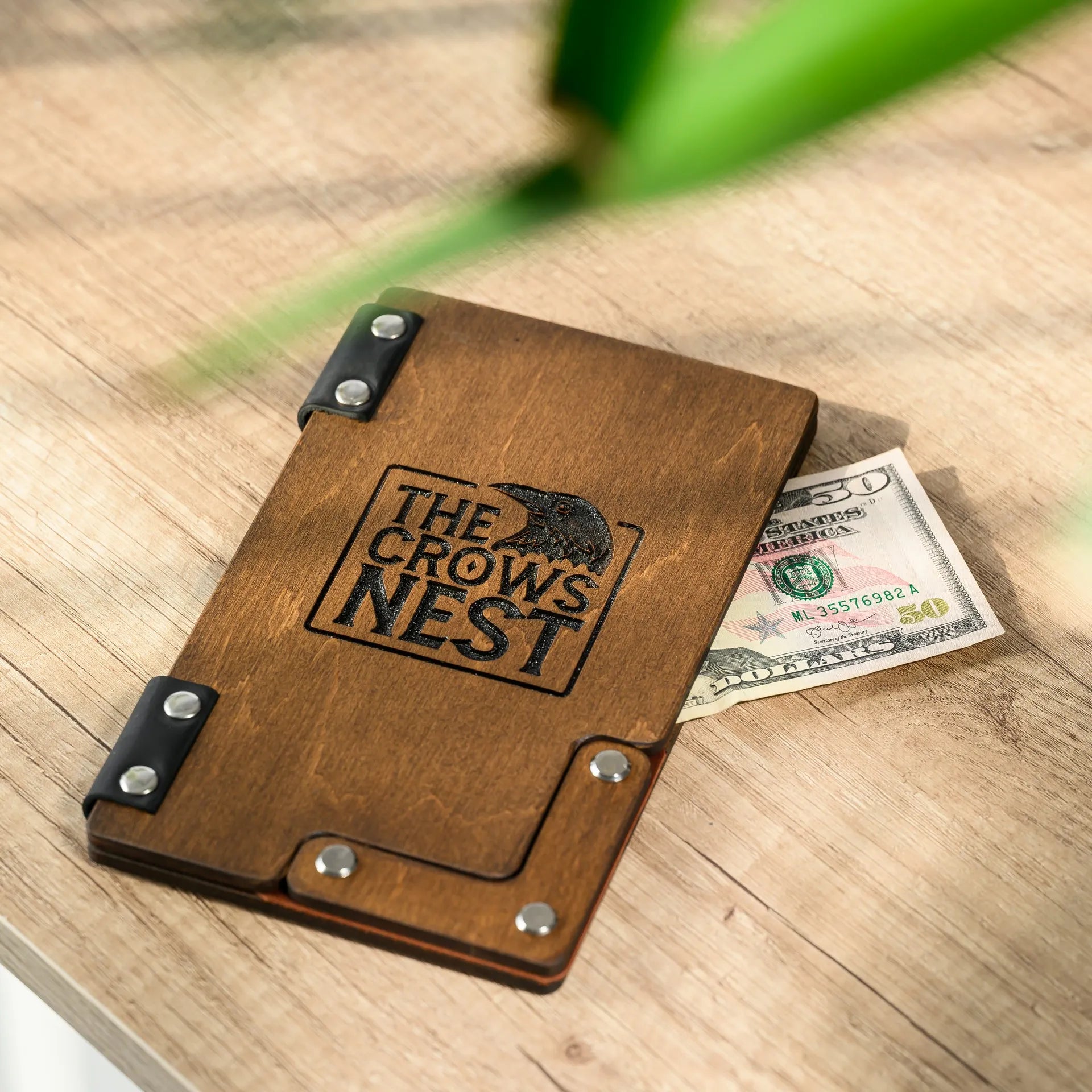 Crafted from high-quality wood, our check holder offers durability and timeless appeal, enhancing the ambiance of your restaurant.