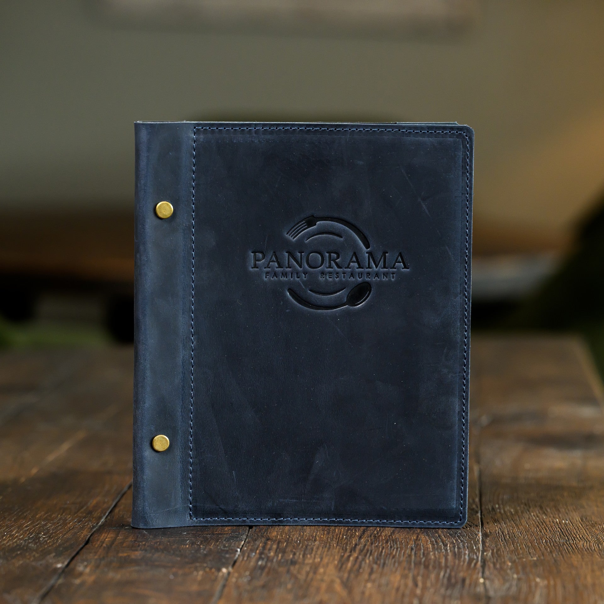 Showcase your menu with our hard cover holder, featuring corner mounting for a refined and sturdy presentation.