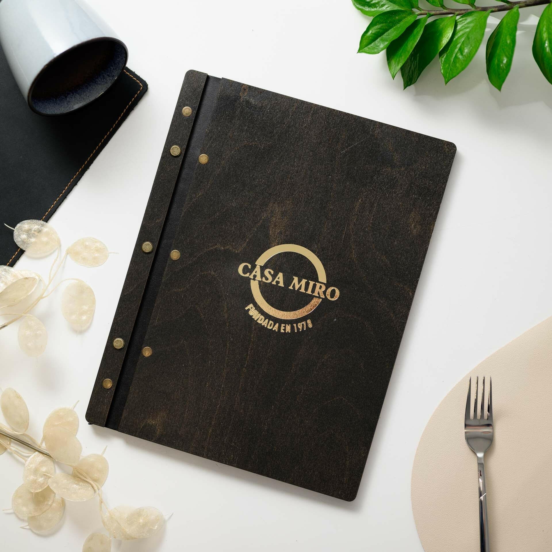 Engraved Wooden Menu Holder: Impresses diners with intricate detailing.