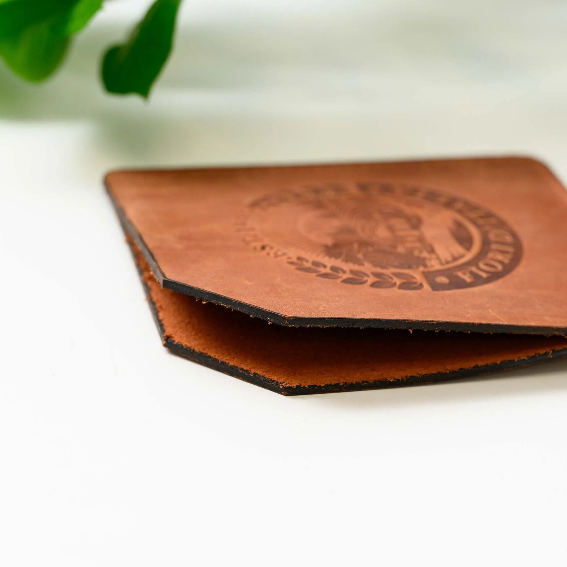 Personalized Bar Check Holder: Add a touch of sophistication with a custom-embossed leather check holder.