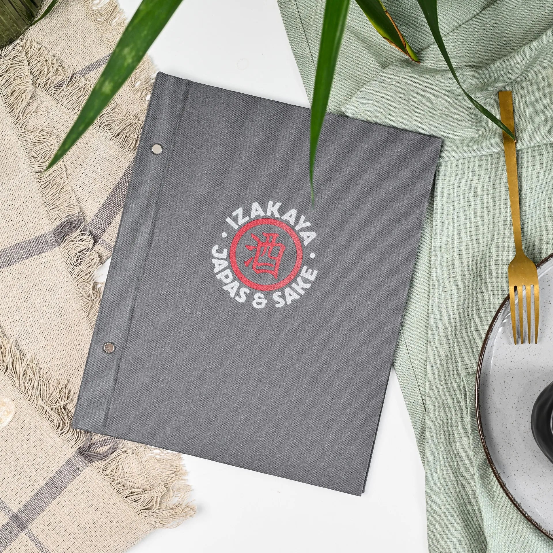 Custom fabric menu folder with logo, ideal for restaurants. Durable cover and changeable sheets make updating your drink menu easy and stylish.