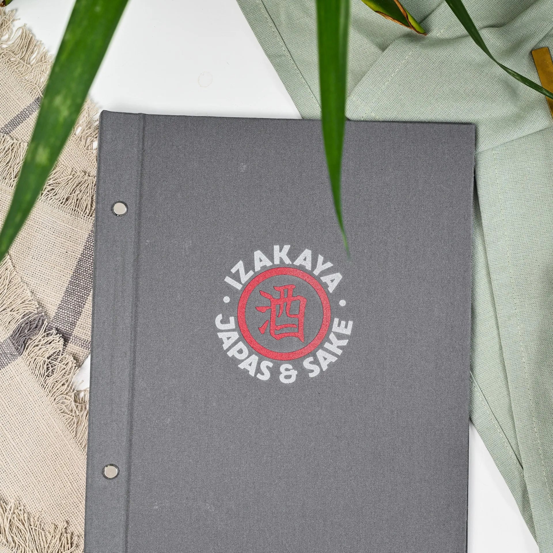 Customizable fabric menu folder with logo, designed for restaurant drink menus. Durable construction with changeable sheets for convenience.