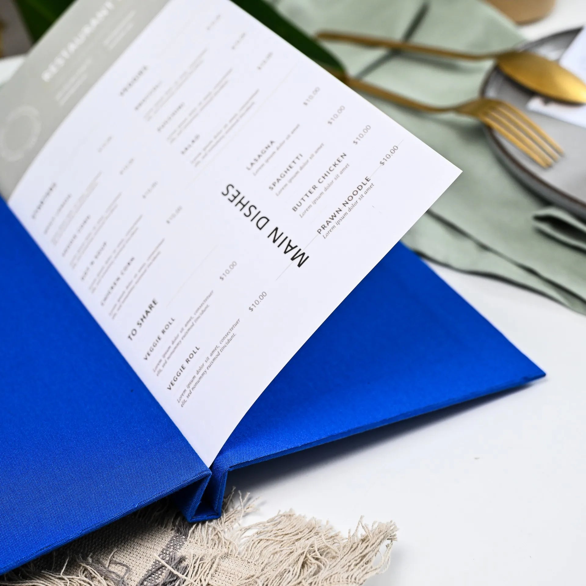 Customizable fabric menu cover with logo, perfect for restaurants. Durable design with changeable sheets for effortlessly updating drink and wine lists.