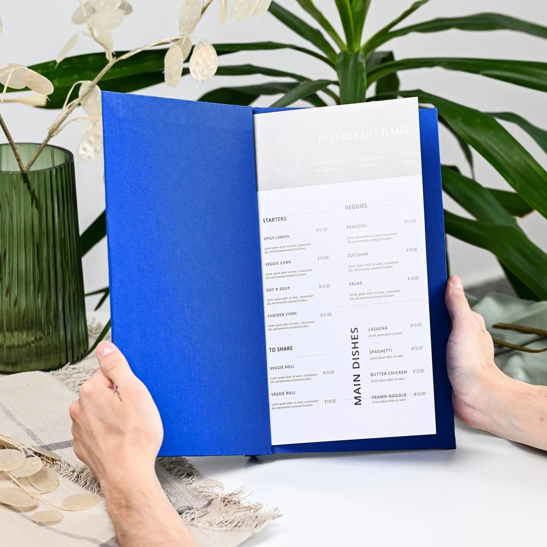 High-quality fabric menu folder with custom logo, designed for restaurant drink menus. Easily changeable sheets provide flexibility and ease of use.