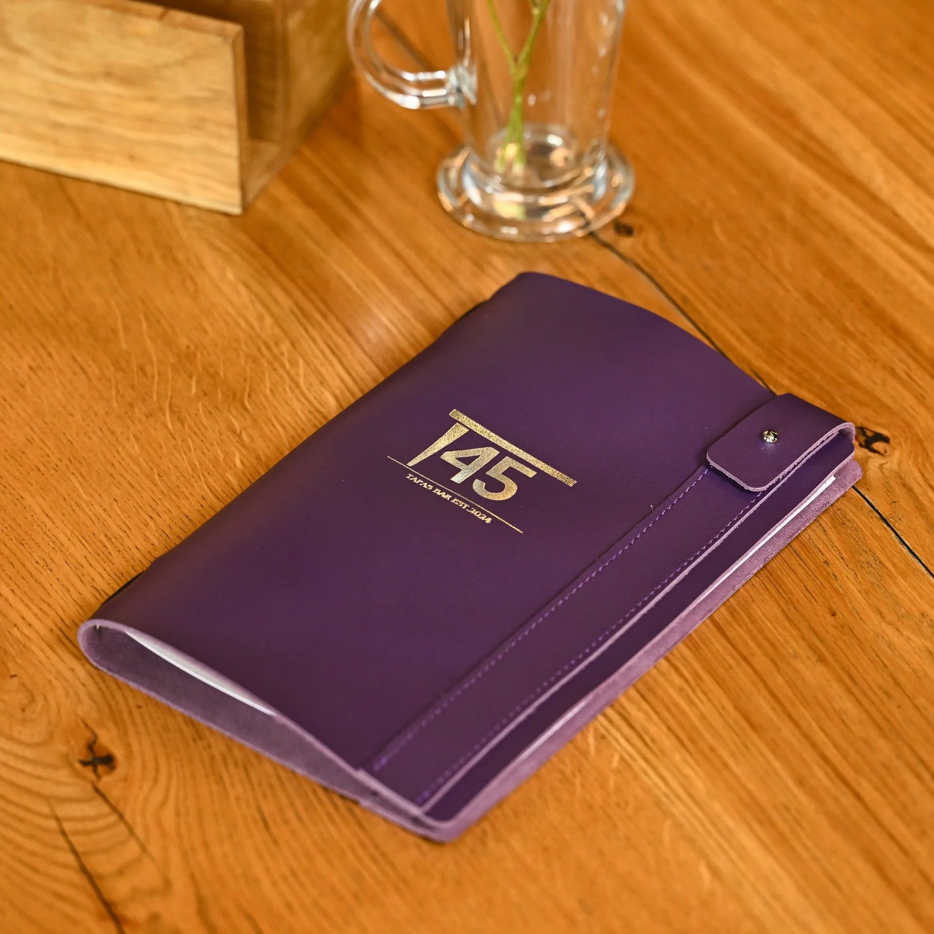 Drink menu cover made from durable leather, featuring a minimalist design. Ideal for bars and lounges, showcasing beverage lists with style and durability.