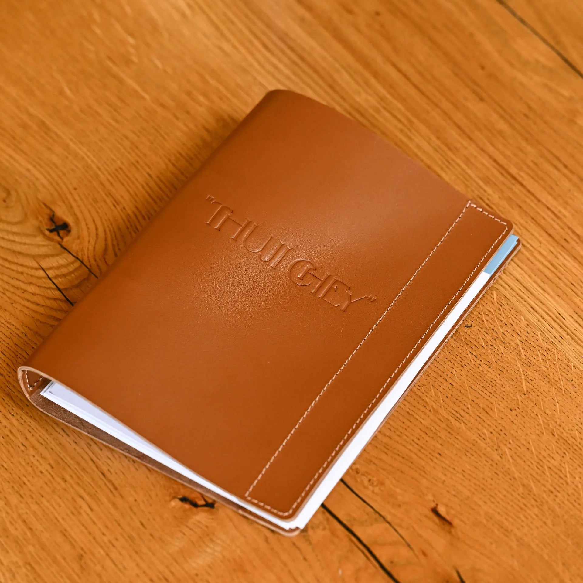 Sophisticated leather menu folio with a plank for fixing A5 sheets. Perfect for restaurants looking for a customizable, stylish menu holder.