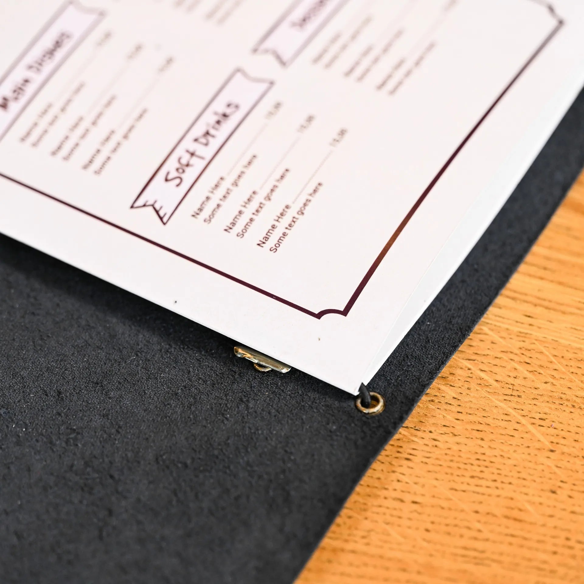 Stylish soft leather menu folio with elastic strap binding. Easily changeable sheets, ideal for cafes and bars, with logo personalization available.