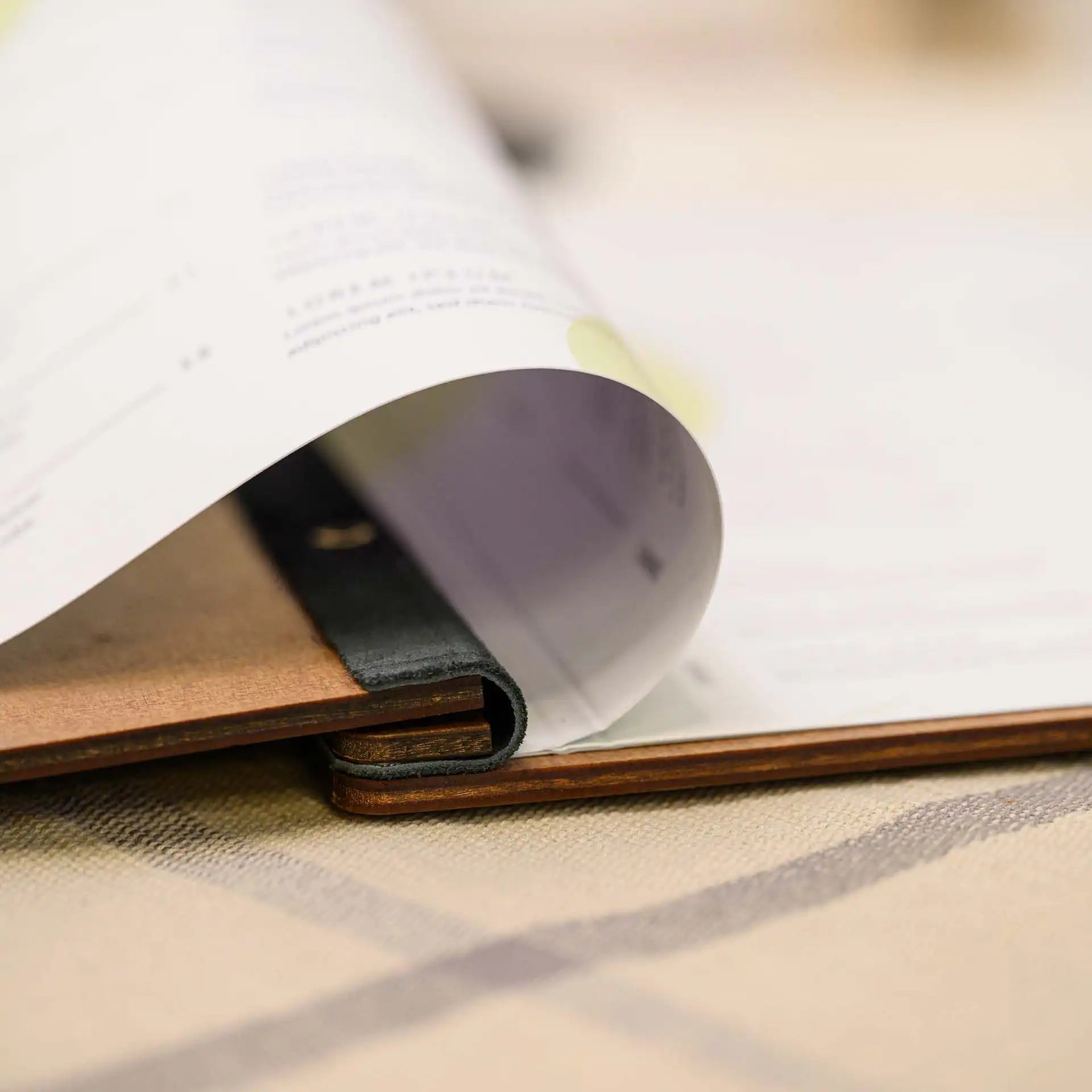 Wooden Menu Folder on Leather Strap: Adds rustic charm and convenience to your menu presentation.