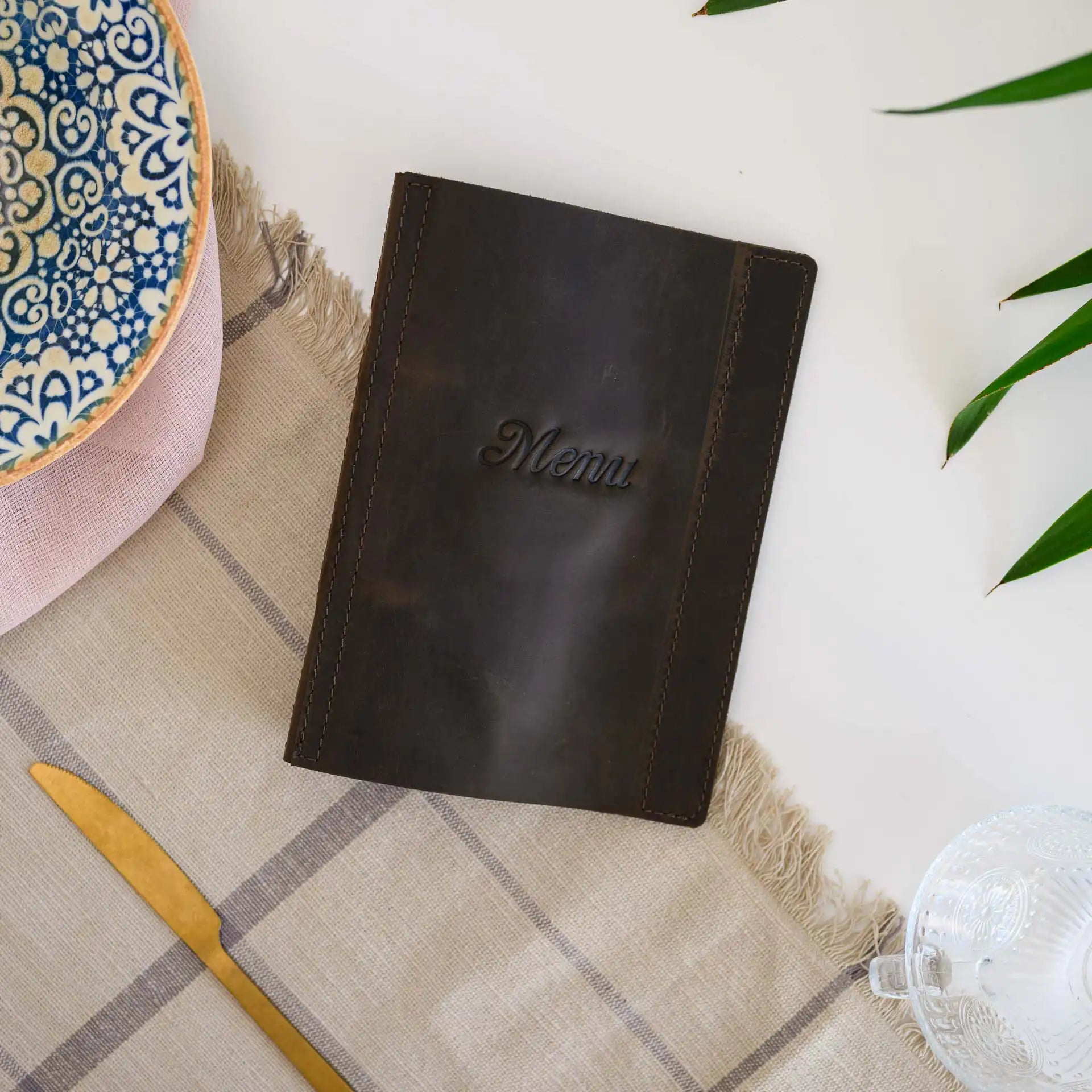 Elevate your restaurant's style with our personalized leather binder, featuring rings for easy menu updates.