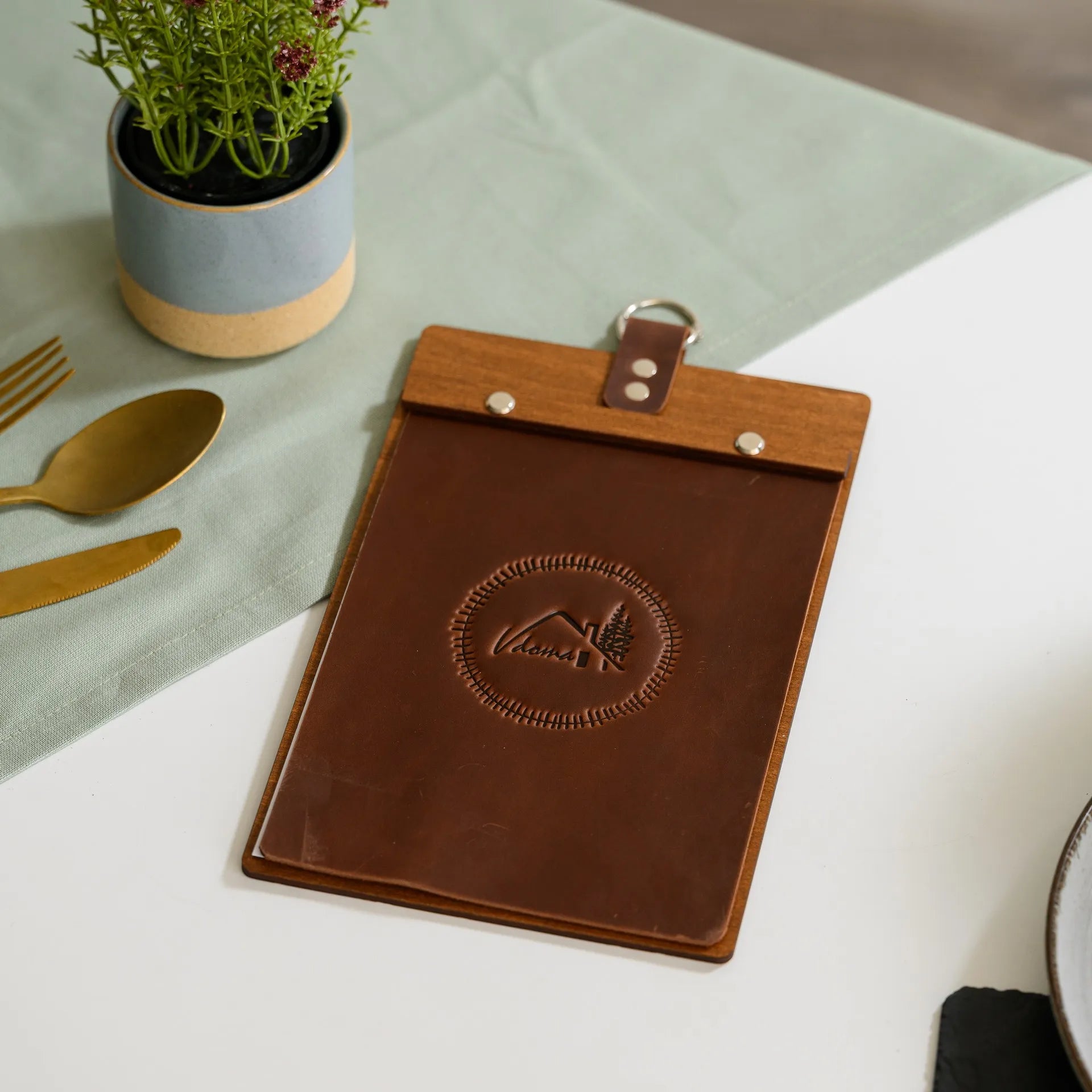 Wooden Menu Holder with Leather Cover: Elegant and durable presentation for menus.