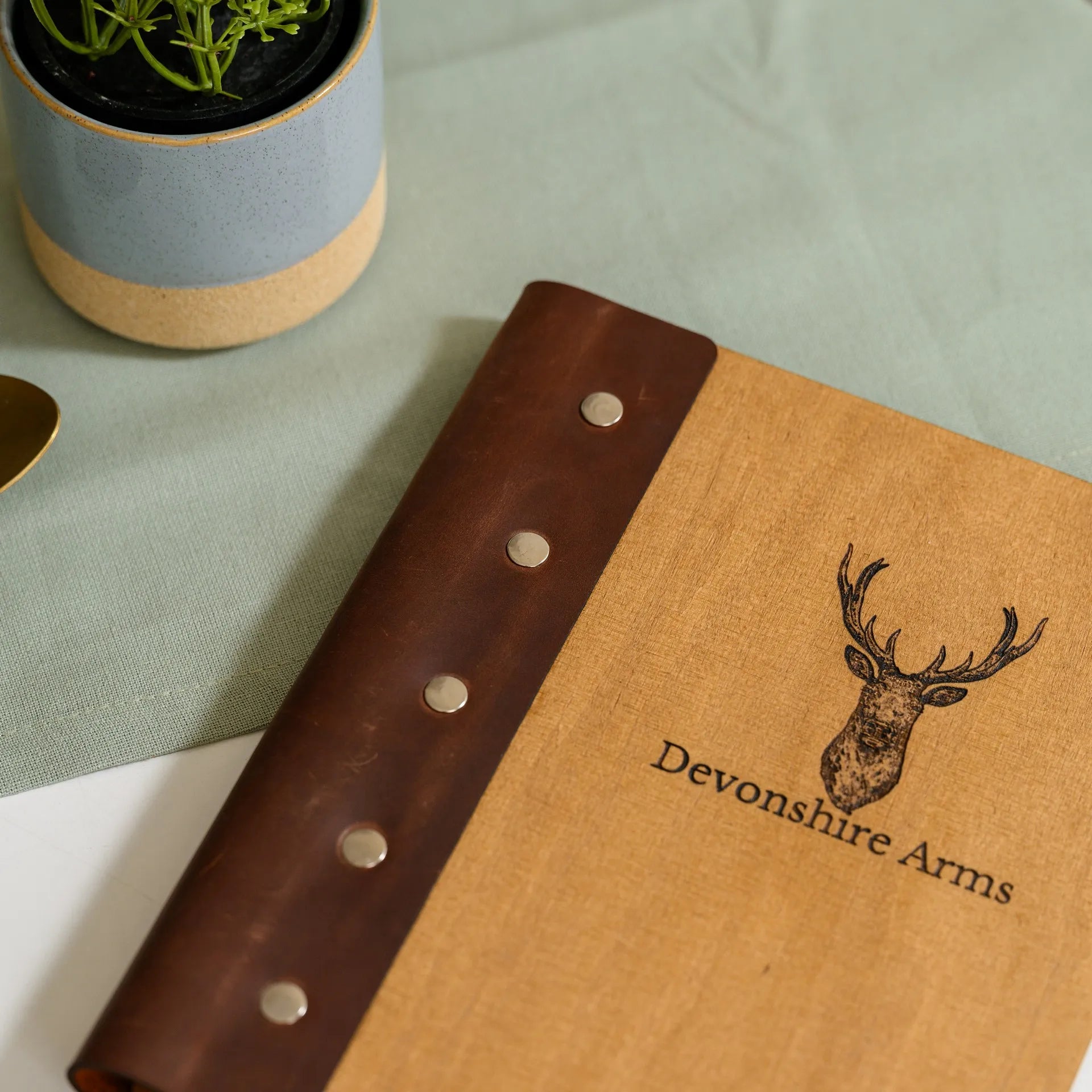 Leather-Fixed Wooden Menu Holder: Combines natural textures for a sophisticated look.