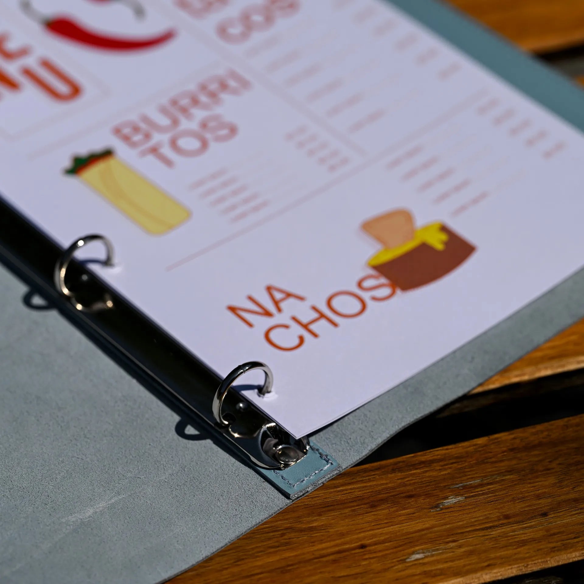 Leather drink menu cover with ring binder for easy page changes, featuring custom logo embossing for an elegant and personalized look.