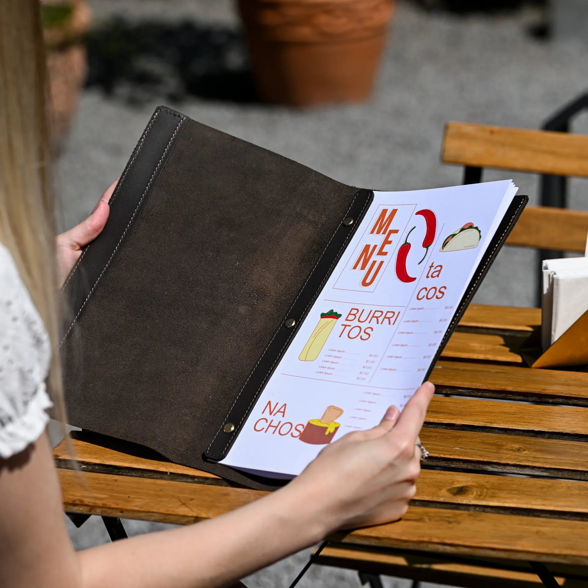 Elegant restaurant leather wine list holder with a fixing plank and embossed logo, designed to securely hold menu sheets in style.