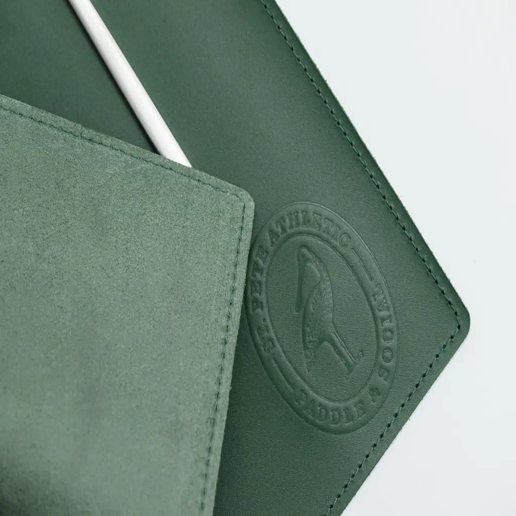 Green leather case with a brand logo on a white background