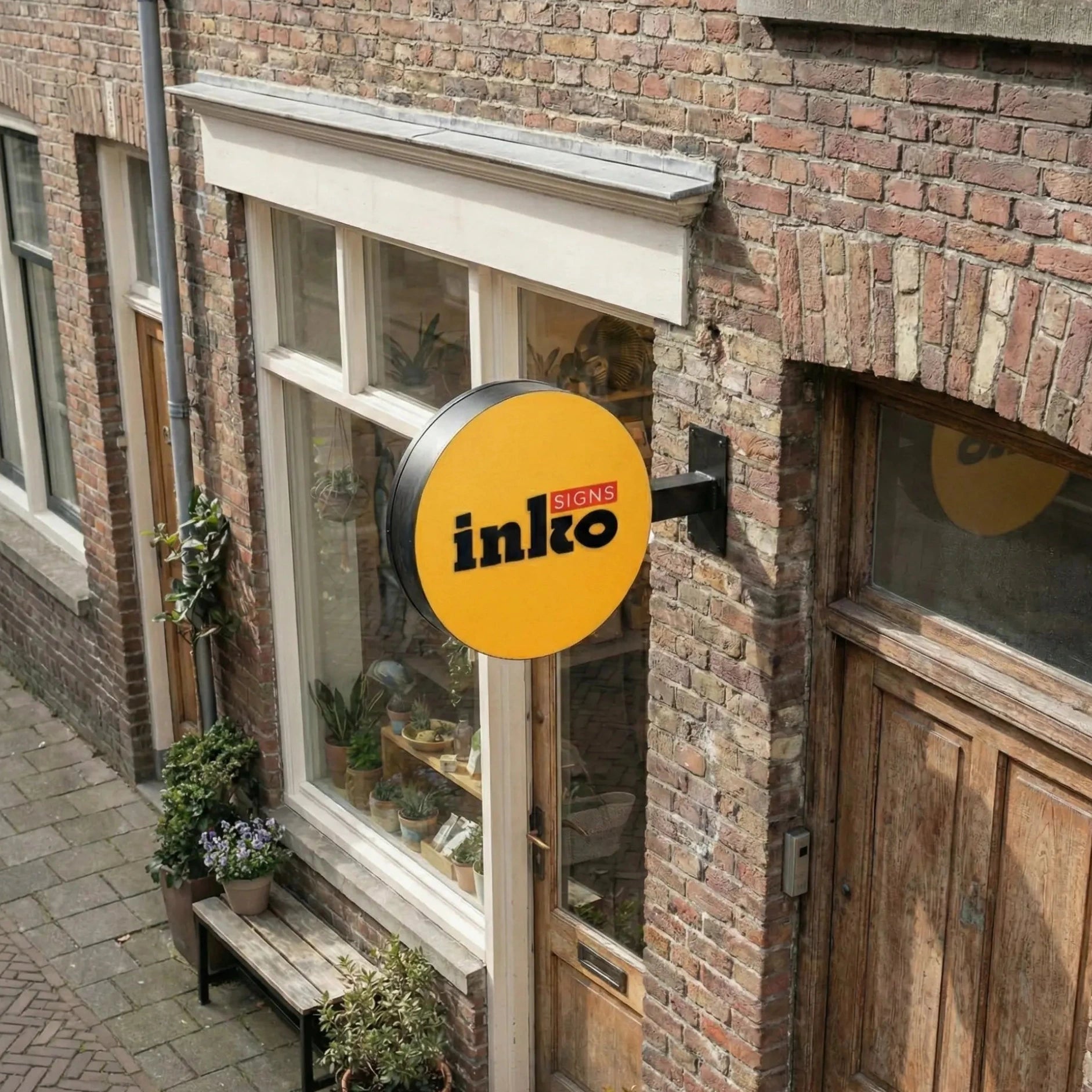 Brick building with a store front and 'inko' sign