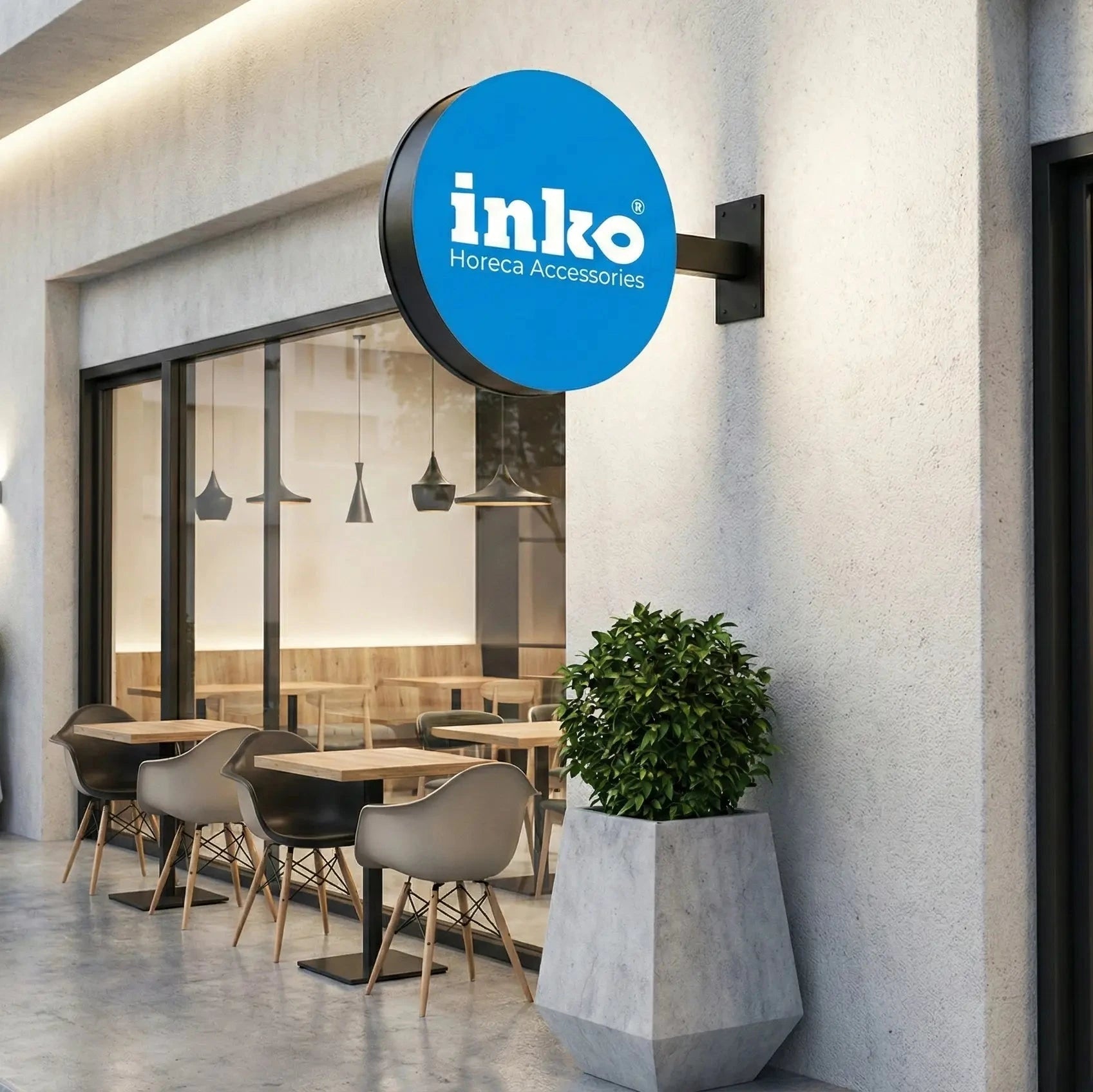 Modern restaurant exterior with 'inko' logo on a building facade