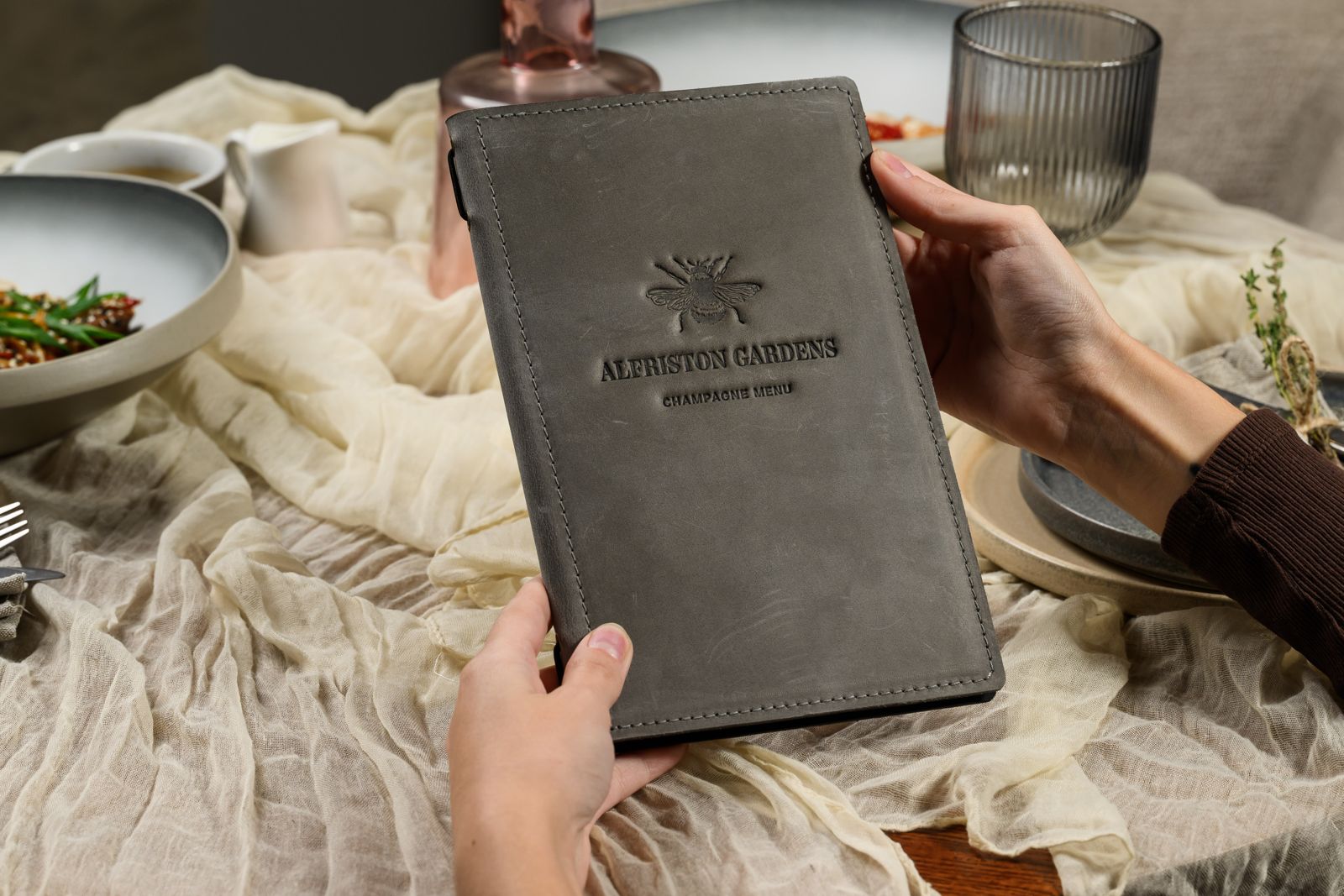 Grey nubuck menu cover with embossed logo