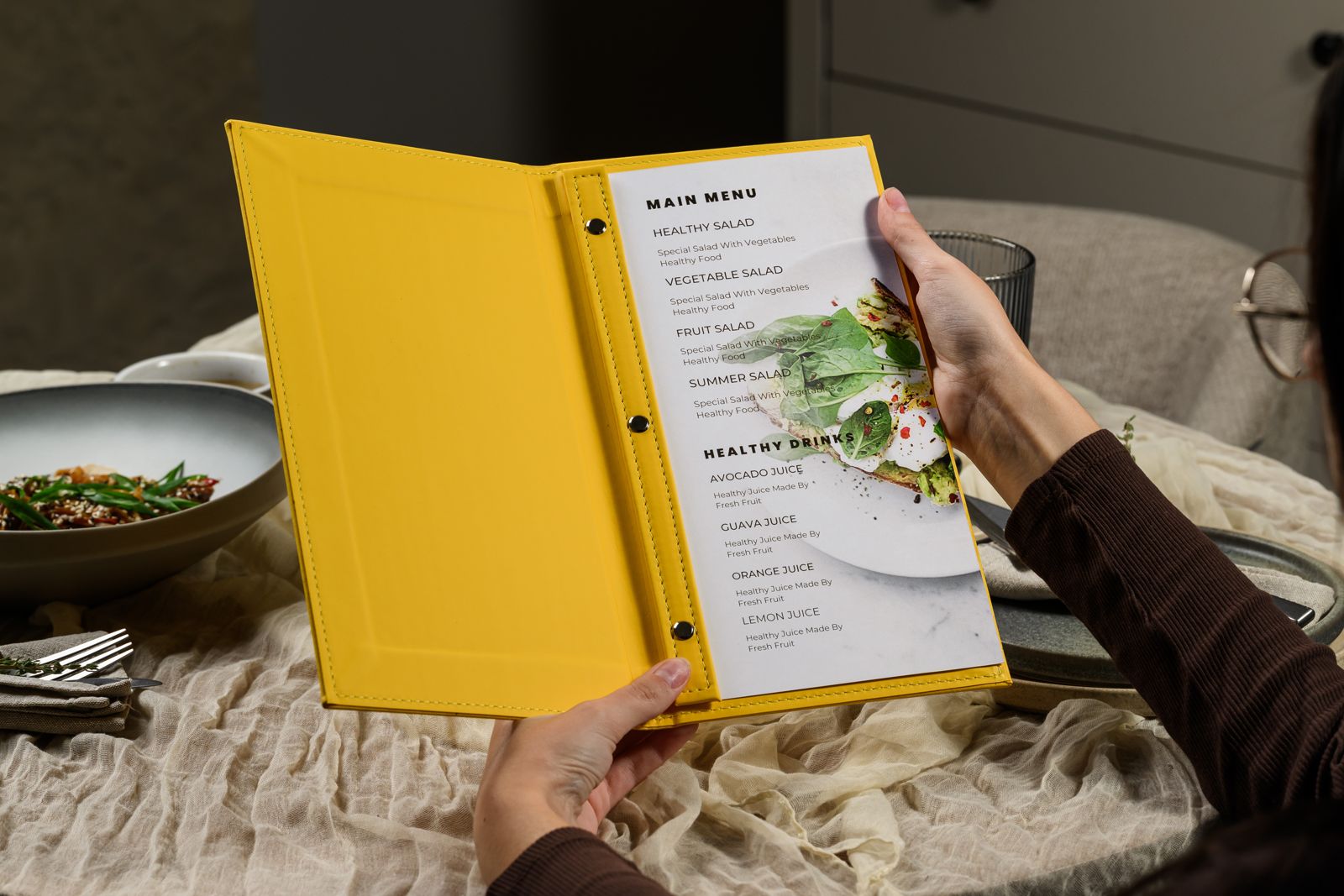 Open yellow leather menu cover with printed menu