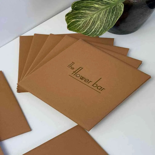 Custom menu covers with DTF-printed logo for The Flower Bar