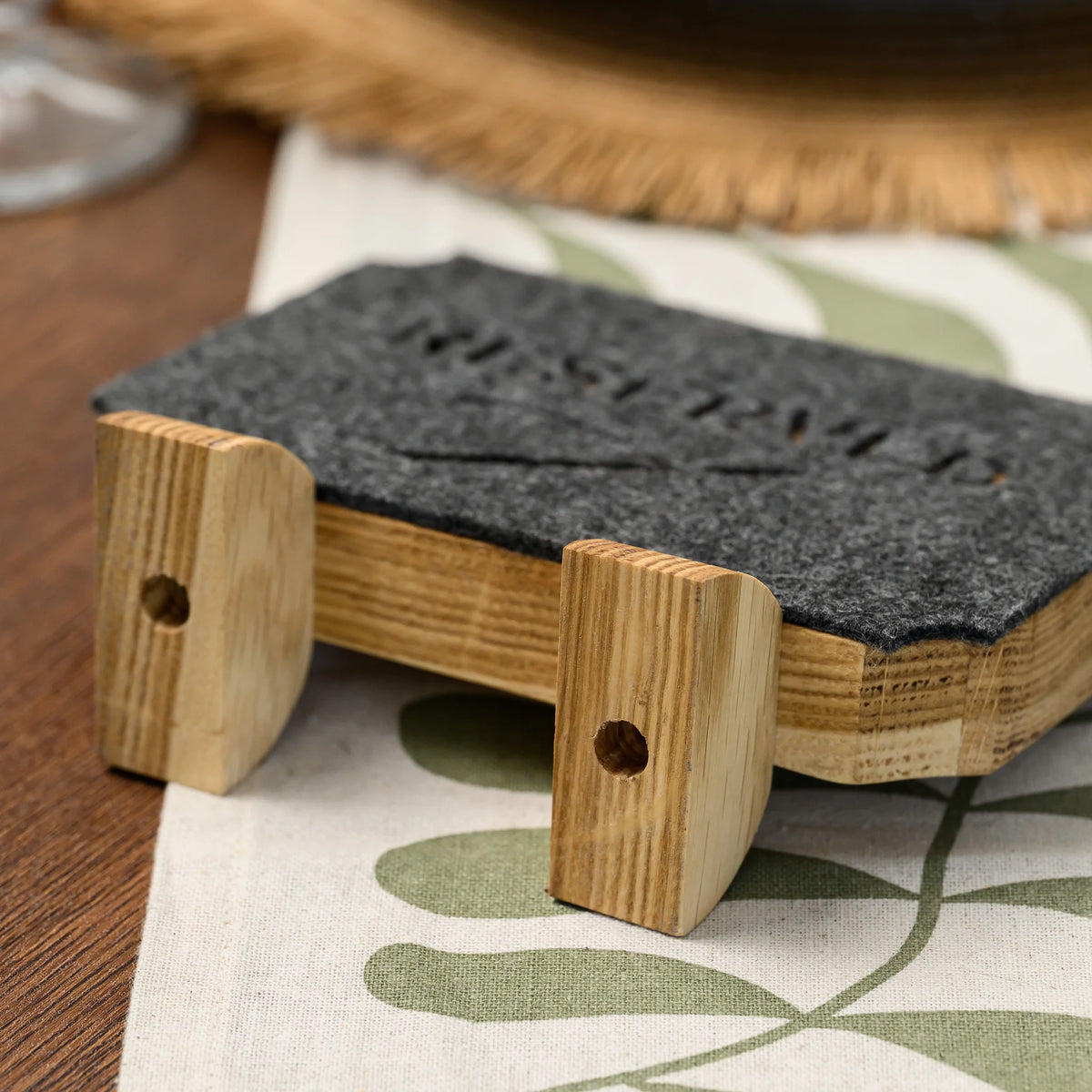 A close-up of the oak leg joints on the back of this freestanding Reserved table sign, viewed up close 