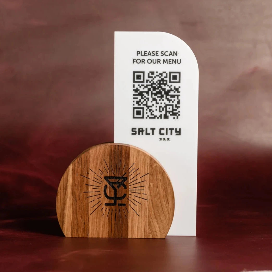 Acrylic QR menu stand with custom logo, elegantly combined with a wooden base for a unique and modern menu holder.